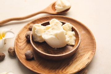 Plate with shea butter on table