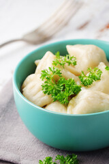 Russian national dish pelmeni served in a plate