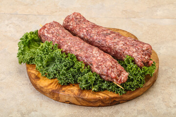 Raw minced beef kebab skewer