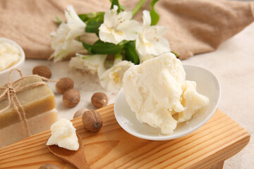 Plate with shea butter on table, closeup