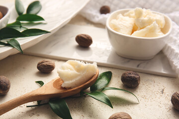 Spoon with shea butter on table - obrazy, fototapety, plakaty