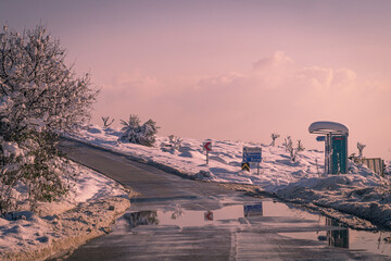 bus stop on the snowy road