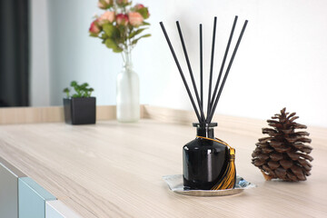 luxury aromatic scent reed diffuser glass bottle is used as room freshener on the wooden table in...