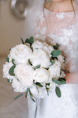 bride holding a bouquet of flowers in a rustic style, wedding bouquet. Soft focus