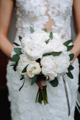 bride holding a bouquet of flowers in a rustic style, wedding bouquet. Soft focus