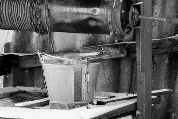 Metal bucket near the old village well