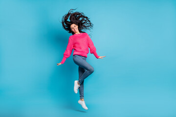 Full length photo of charming carefree person jump hair fly have good mood isolated on blue color background
