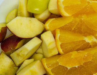 Apple slices and orange view top close-up