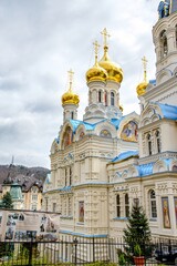 Fototapeta na wymiar Karlovy Vary, Czech republic. Orthodox church with cloudy sky