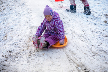 happy little girl goes down the mountain in the Alps, horizontal