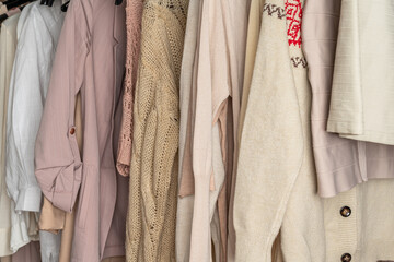 .Assortment of woman modern summer and autumn clothing in garment store. Shopping. Close up.