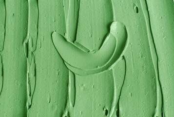 Green cosmetic clay (cucumber facial mask, avocado face cream, green tea matcha body wrap) texture...
