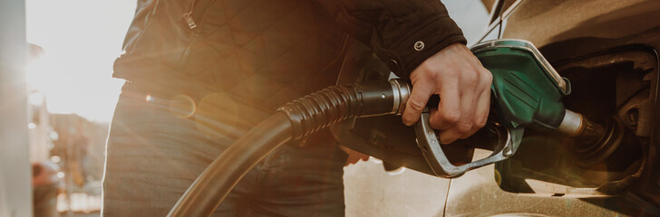 Obraz premium Process of refueling the car by a petrol in the gas station