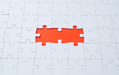 Empty white jigsaw puzzle with  missing pieces