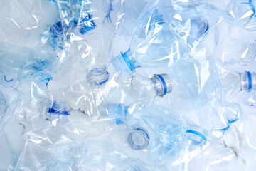Many used plastic bottles as background, top view. Recycling problem
