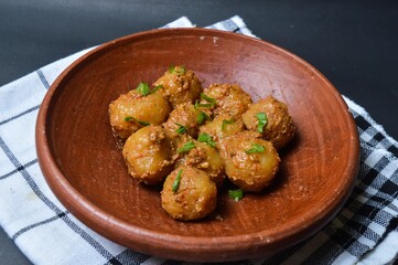 Cilok is balls prepared with a base of tapioca flour. Whether boiled or fried, cilok balls are typically accompanied by a sweet peanut sauce or spicy sauces based on ketchup and kecap manis. 