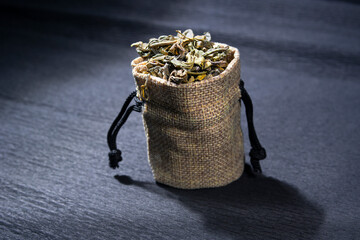 Green tea in a bag on the background