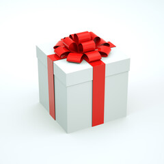 White gift box with a red ribbon bow isolated on a white background.