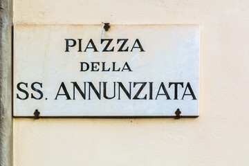 Piazza della SS. Annunziata street sign on the wall in Florence, Italy