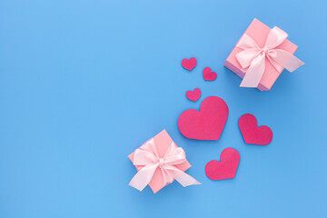 Valentines day composition: two pink gift boxes with ribbon