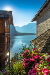 Postcard view of famous Hallstatt lakeside town,Austria. Scenic panoramic view of beautiful houses,blooming flowers,Hallstatter See.Amazing sunny day in summer, Salzkammergut region.Urban city scene.