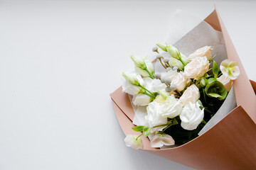 Female hands florist making a bouquet. Step by step instraction. Top horizontal view copyspace pink background