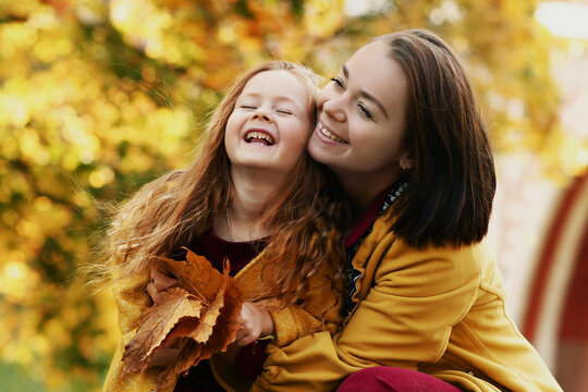 Irish little girl with mom outdoor photo on fall landscape background