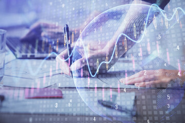 Multi exposure of woman hands typing on computer and financial chart hologram drawing. Stock market analysis concept.
