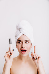 Woman has idea how to make her face tone better. Portrait of lady during morning routine with concealer in hand