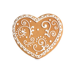 Gingerbread heart decorated with icing isolated on white