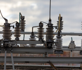 Electrical substation with wires at dawn.