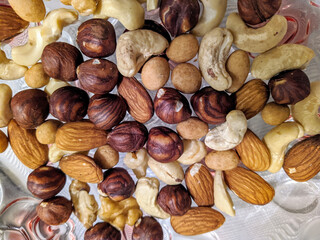 many varieties of nuts closeup photo top view