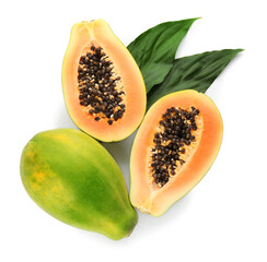 Fresh ripe papaya fruits with green leaves on white background, top view