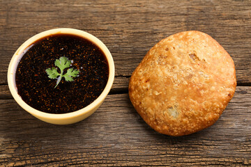 Kachori is a spicy snack from India also spelled as kachauri and kachodi. Served with tomato ketchup. Favorite Tea time snacks