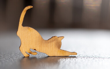 Close up of toy wooden cat silhouette. Macro