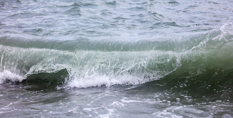 Wave in the sea with splashing water.