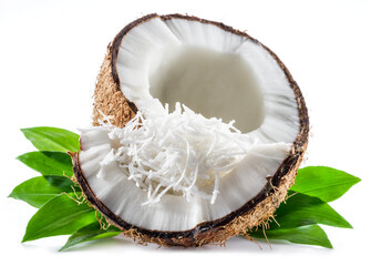 Cracked coconut fruit with white flesh and shredded coconut flakes isolated on white background.