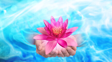 Man holding beautiful lotus flower on bright background, closeup