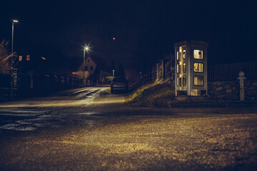 night telephone booth. mystical and mysterious street phone. dangerous place on an empty street