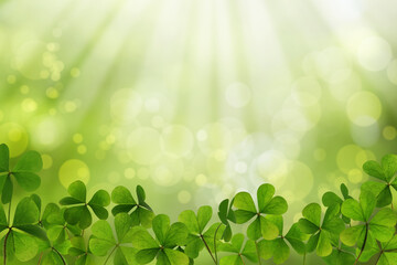 Fresh clover leaves on green background. St. Patrick's Day celebration © New Africa