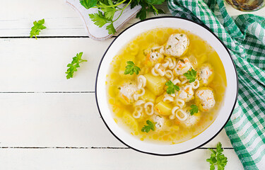 Healthy chicken meatballs soup and pasta. Simple recipe for cooking at home. Top view, flat lay