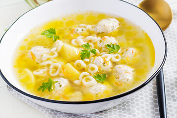 Healthy chicken meatballs soup and pasta. Simple recipe for cooking at home.