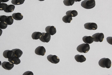 Black beans on white background.
