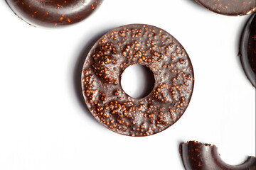 Raw vegan homemade chocolate candy balls on a white background. Top view in the form of donuts