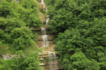 A beautiful cascading waterfall high in the mountains.