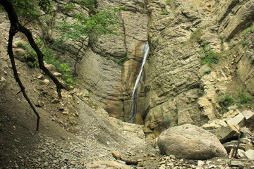 Obraz premium Beautiful, picturesque waterfall inside the mountain.