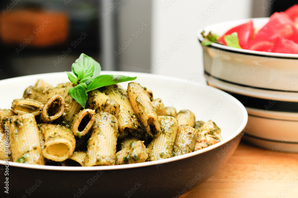 Poster rigatoni pesto pasta with chicken, basil and parmesan cheese and