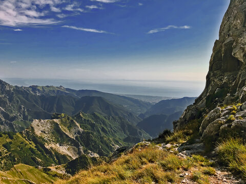 Scenic view of italian apuan alps against sky and sea, Carrara, Tuscany, Italy