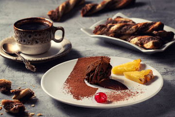 Chocolate cake with fruits.Chocolate truffle. Plate art composition.