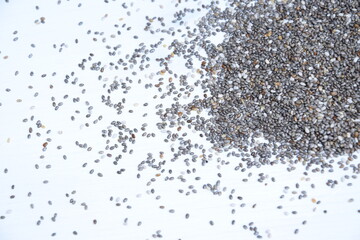 Chia seeds on white wooden background, super food chia